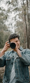 man wears blue denim jacket