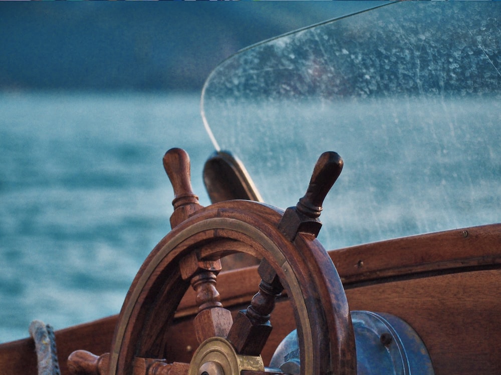 brown wooden ship steering wheel