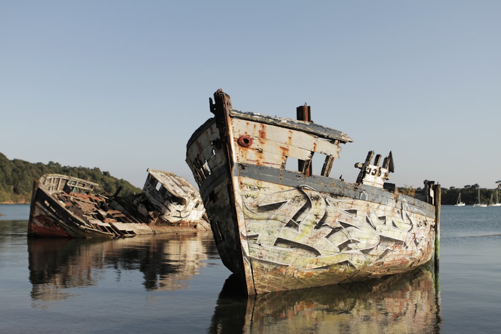 brown wooden boat on body of water