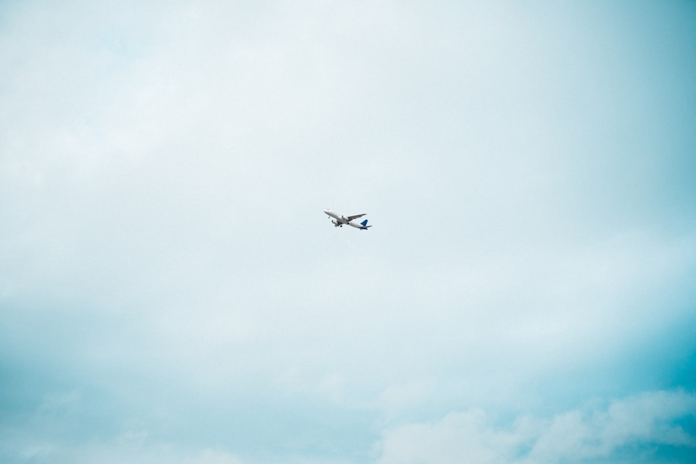 airplane in mid air during day