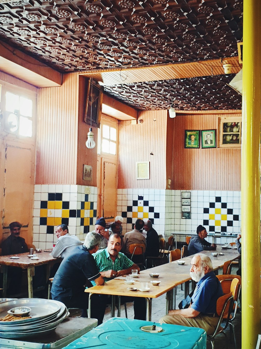 people sitting at table inside room