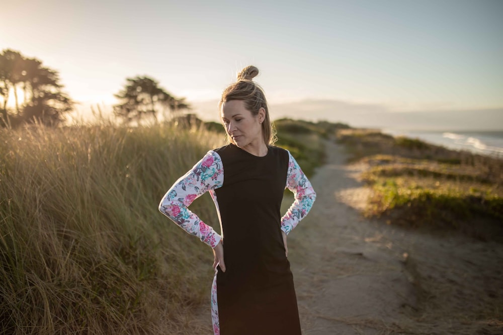 woman wearing white, pink, blue, and black long-sleeved dress