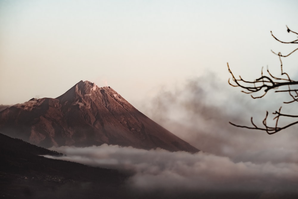 mountain and clouds during day