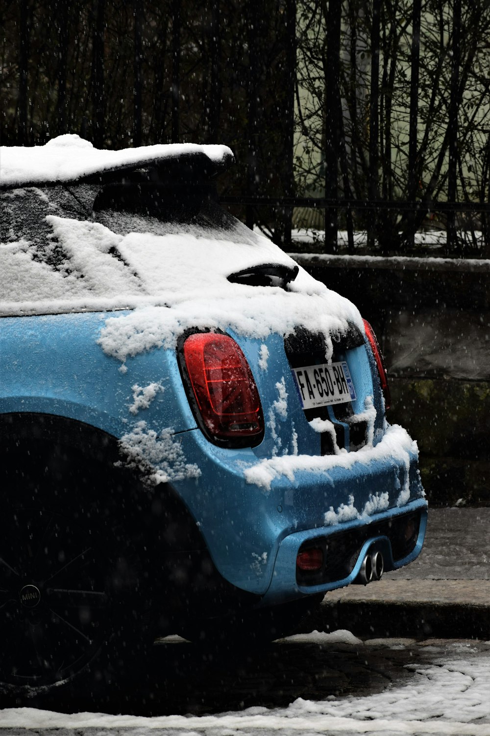 snow-covered blue vehicle