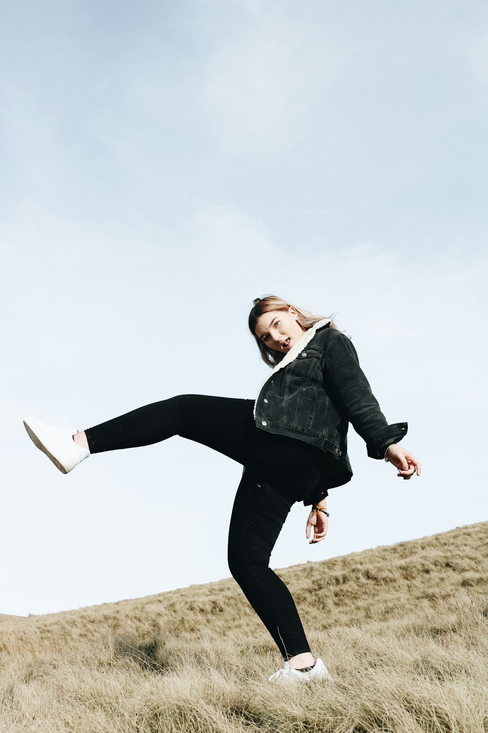 woman wears black parka jacket