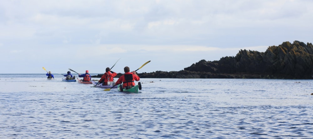 men riding kayak