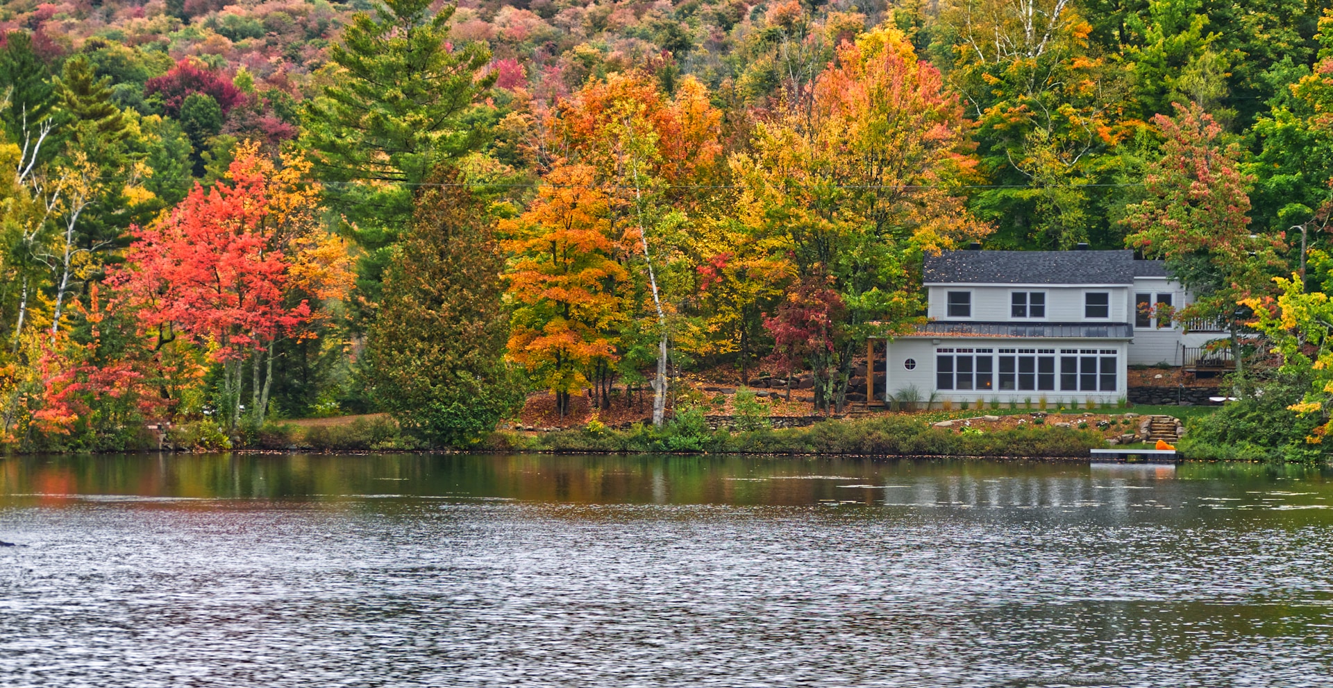 white building near body of water