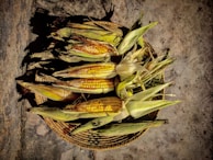 Colorful baskets filled with freshly harvested maize and rice.