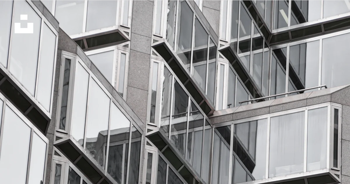 Red object behind glass building wall photo – Free Grey Image on Unsplash