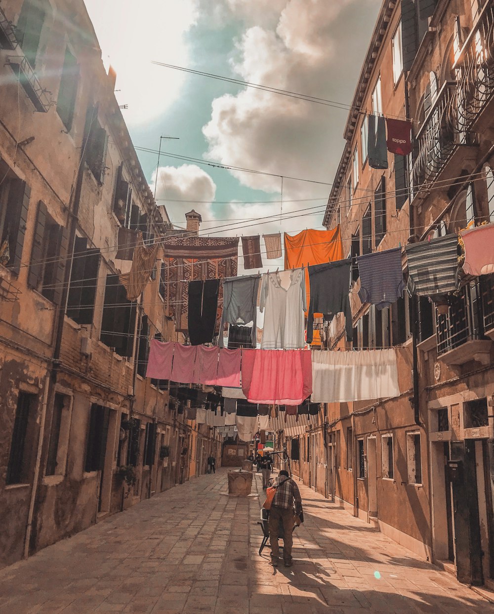 man standing under clothes