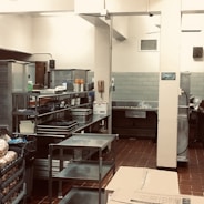 A modern commercial kitchen setup with stainless steel appliances.