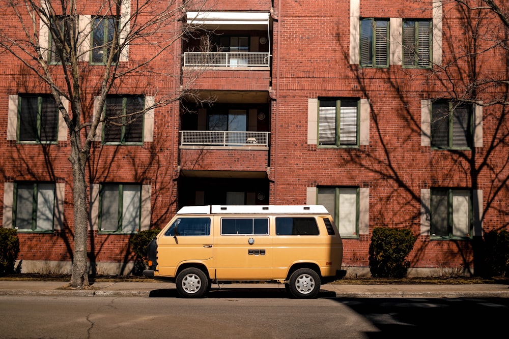 orange van outside brown brick building