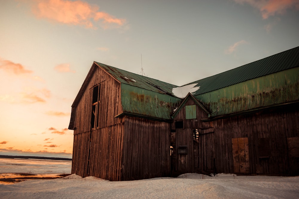 green and brown wooden house under cloudy sky