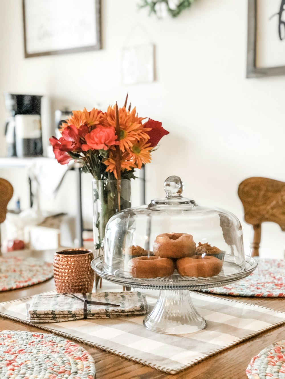 donuts on cake stand with lid on table top