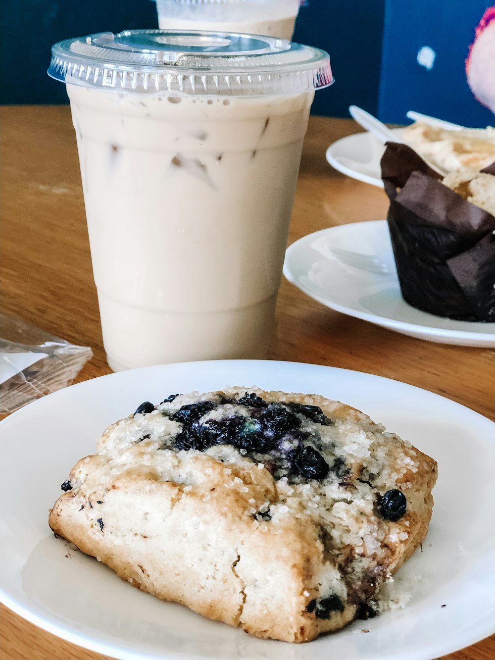 bread on plate beside cup of coffee