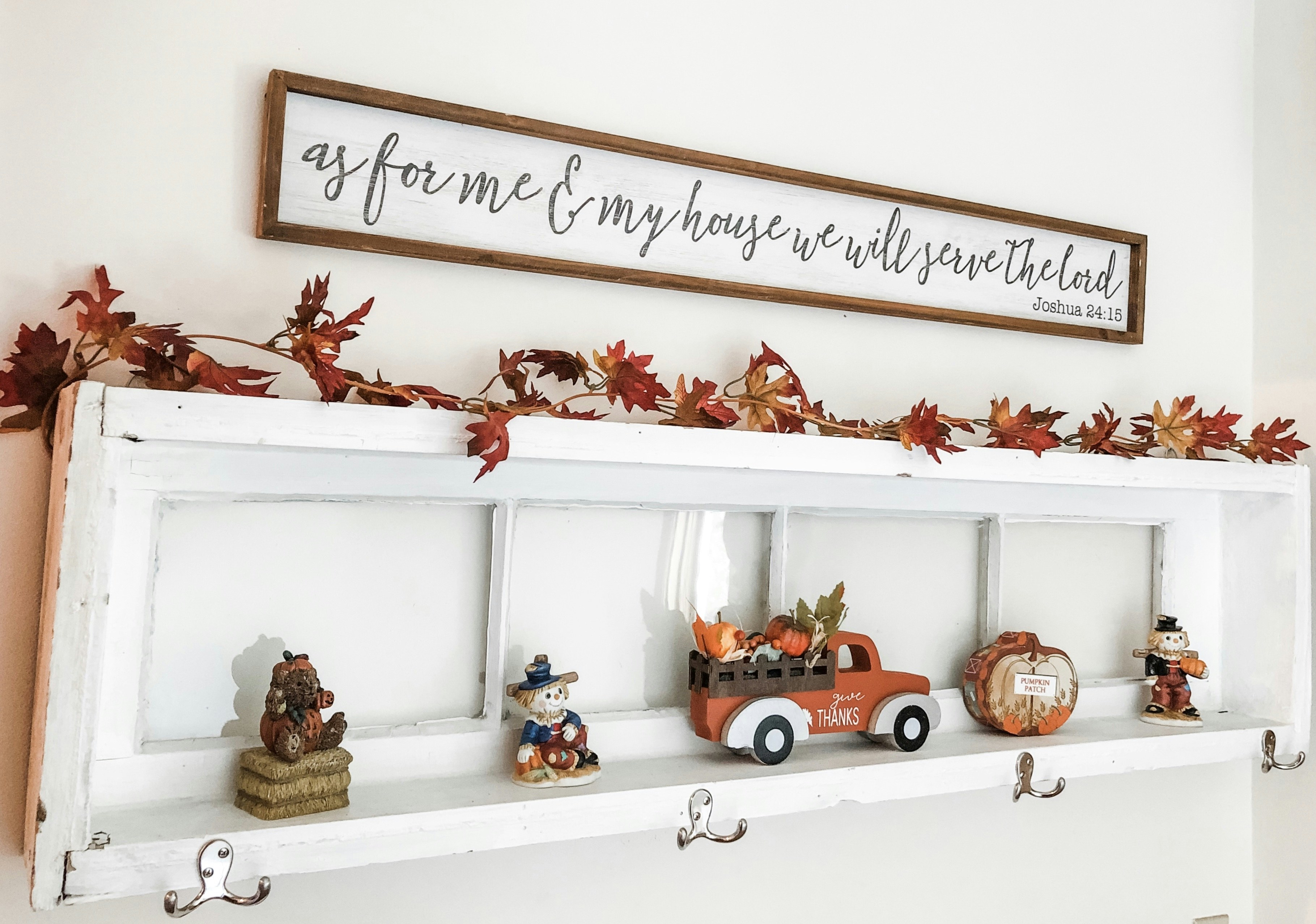 a shelf with a bunch of figurines on top of it
