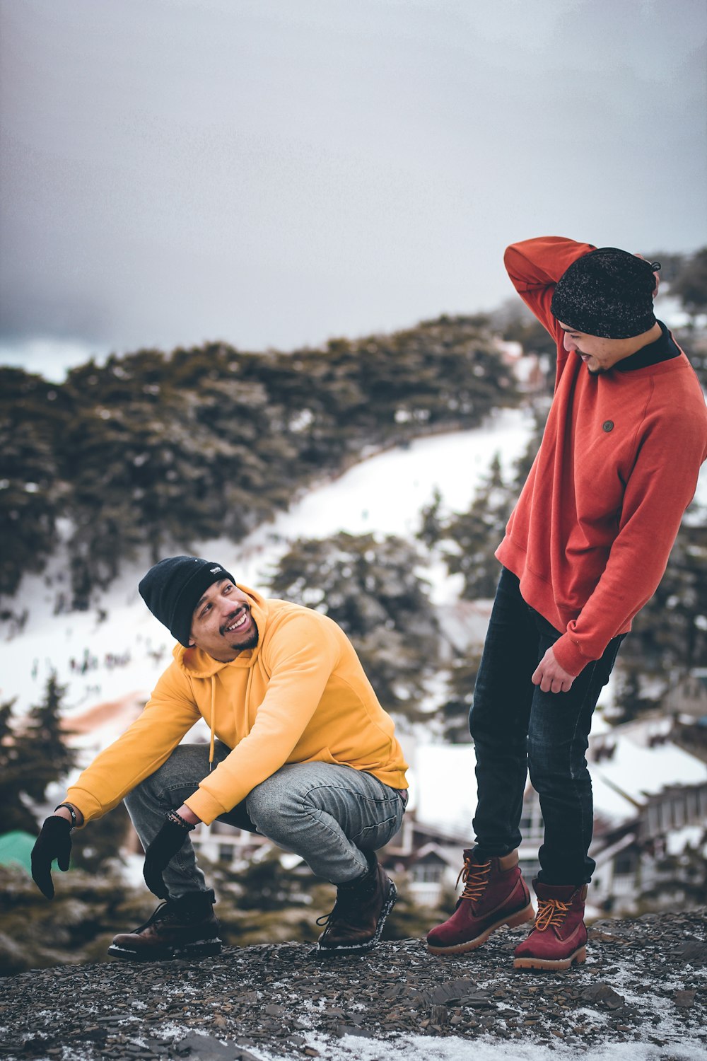 two men wearing knit caps