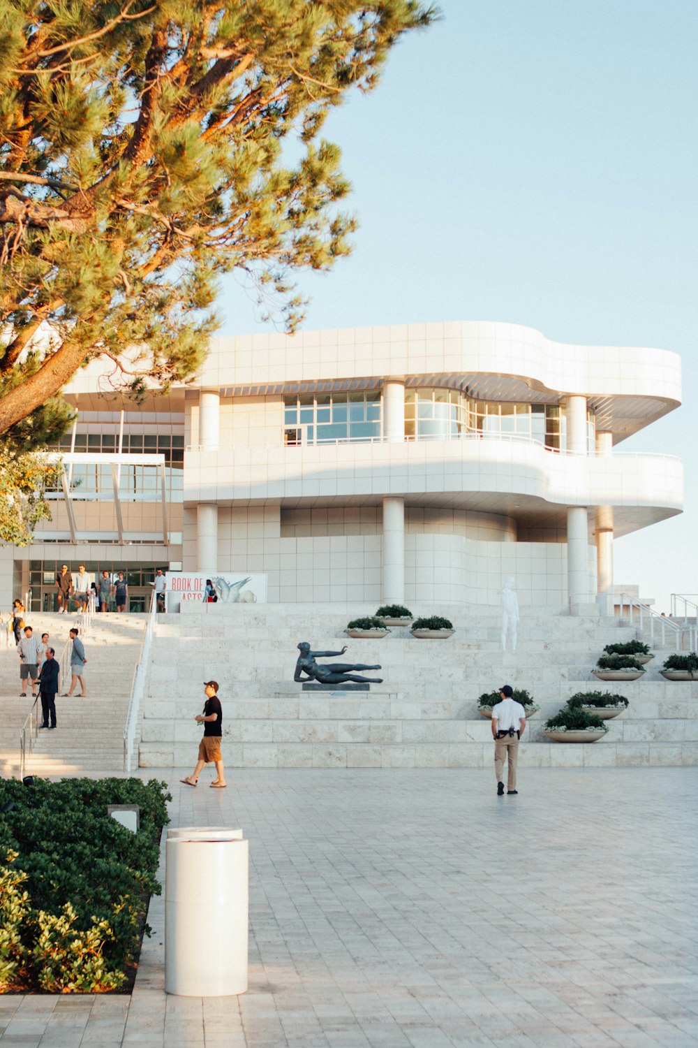 people standing near building at daytime