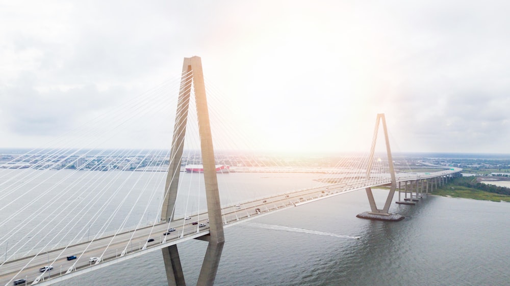 an aerial view of a bridge over a body of water