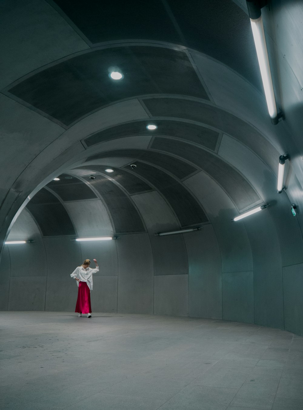 woman standing under tunnel
