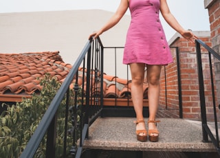 woman standing on concrete stairs