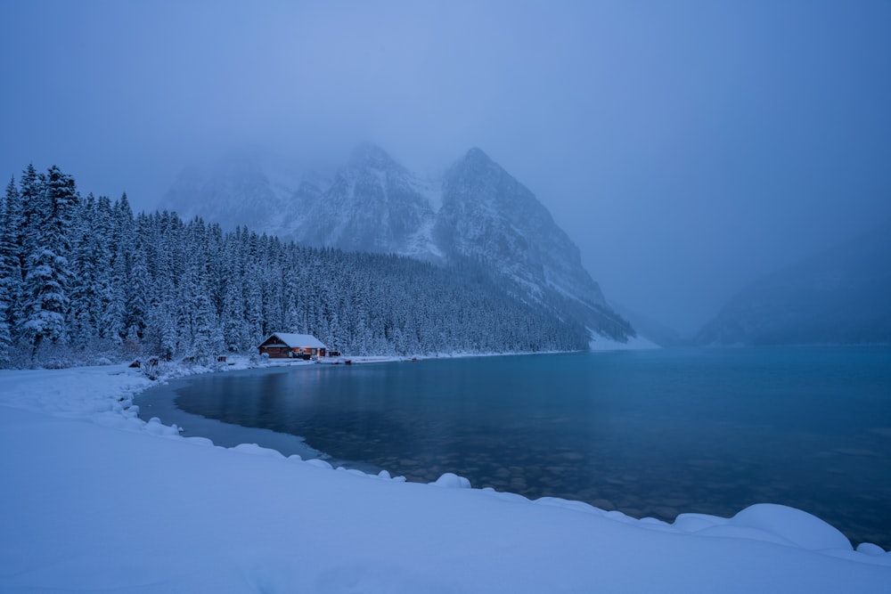 snowy lake and a house landscape