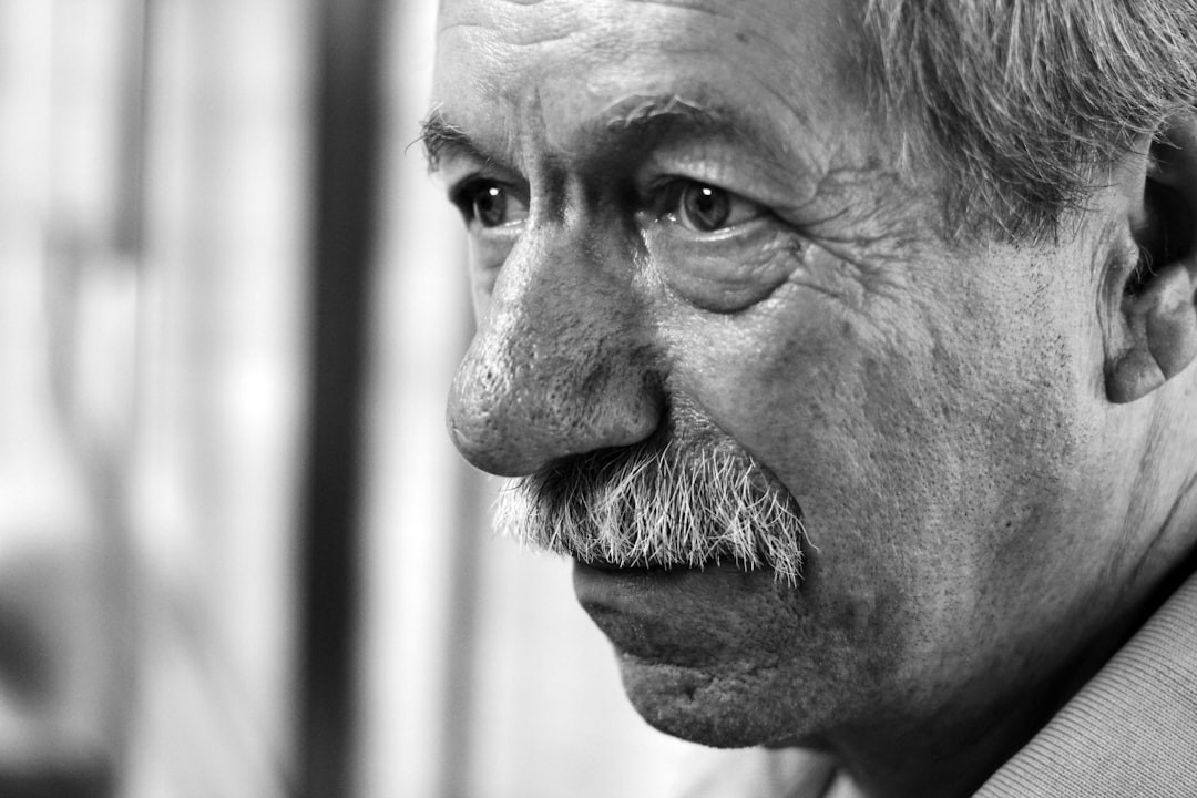 grayscale photo of a man with a moustache
