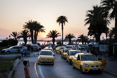 A scenic view of Goa with a taxi parked near the beach.