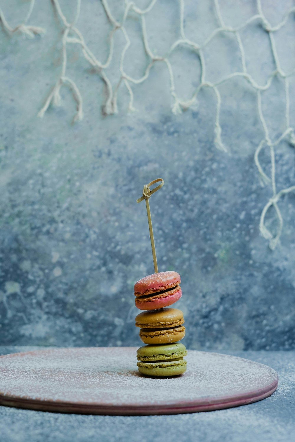 three French macarons on coaster