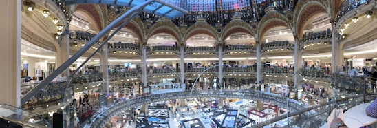 A vibrant shopping center in Muscat, showcasing diverse businesses.