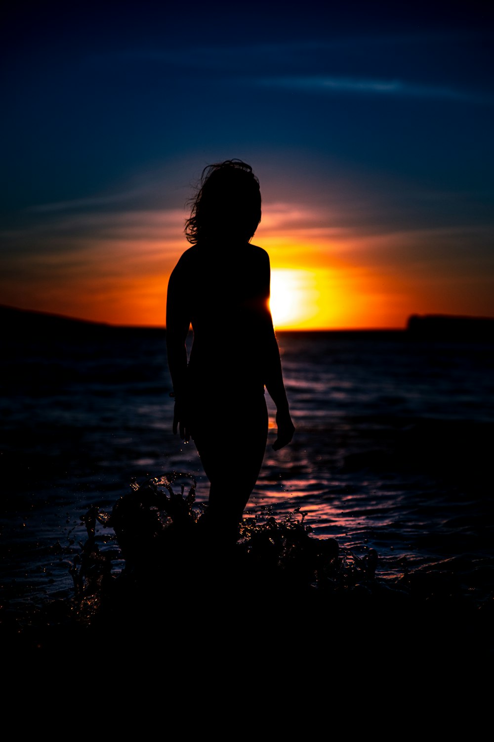silhouette of woman during golden hour