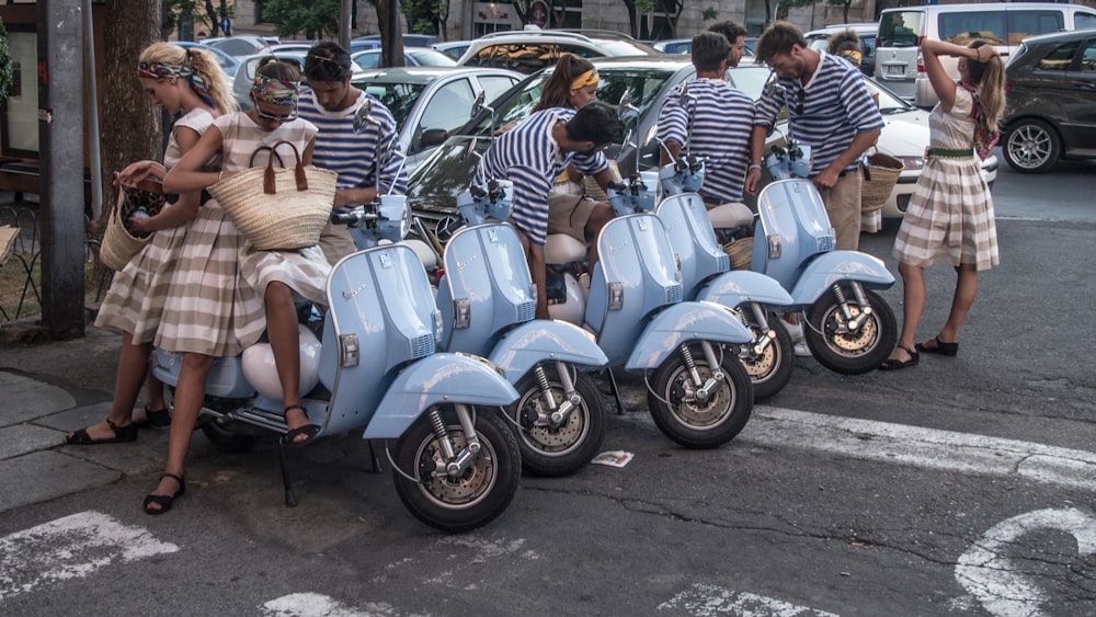 men and women near motorcycles