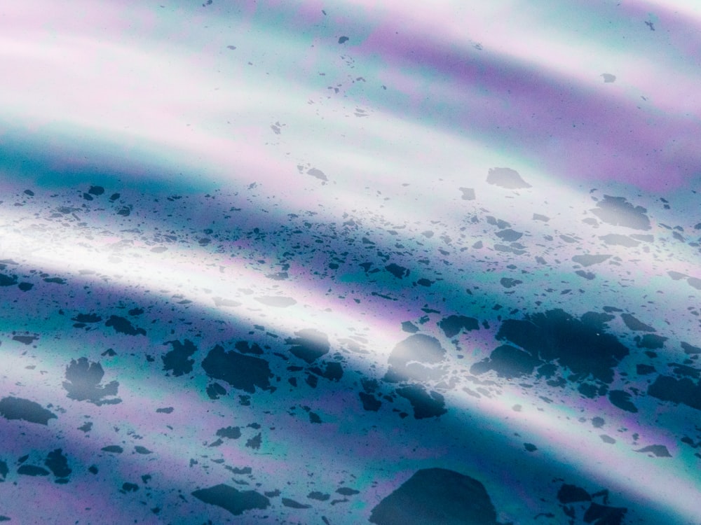 a close up of a blue and purple liquid