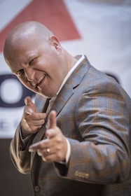 Animated dad figure pointing confidently towards his domain.