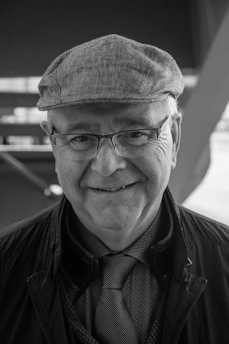 A smiling retired government worker receiving advice on pension credits from a consultant.