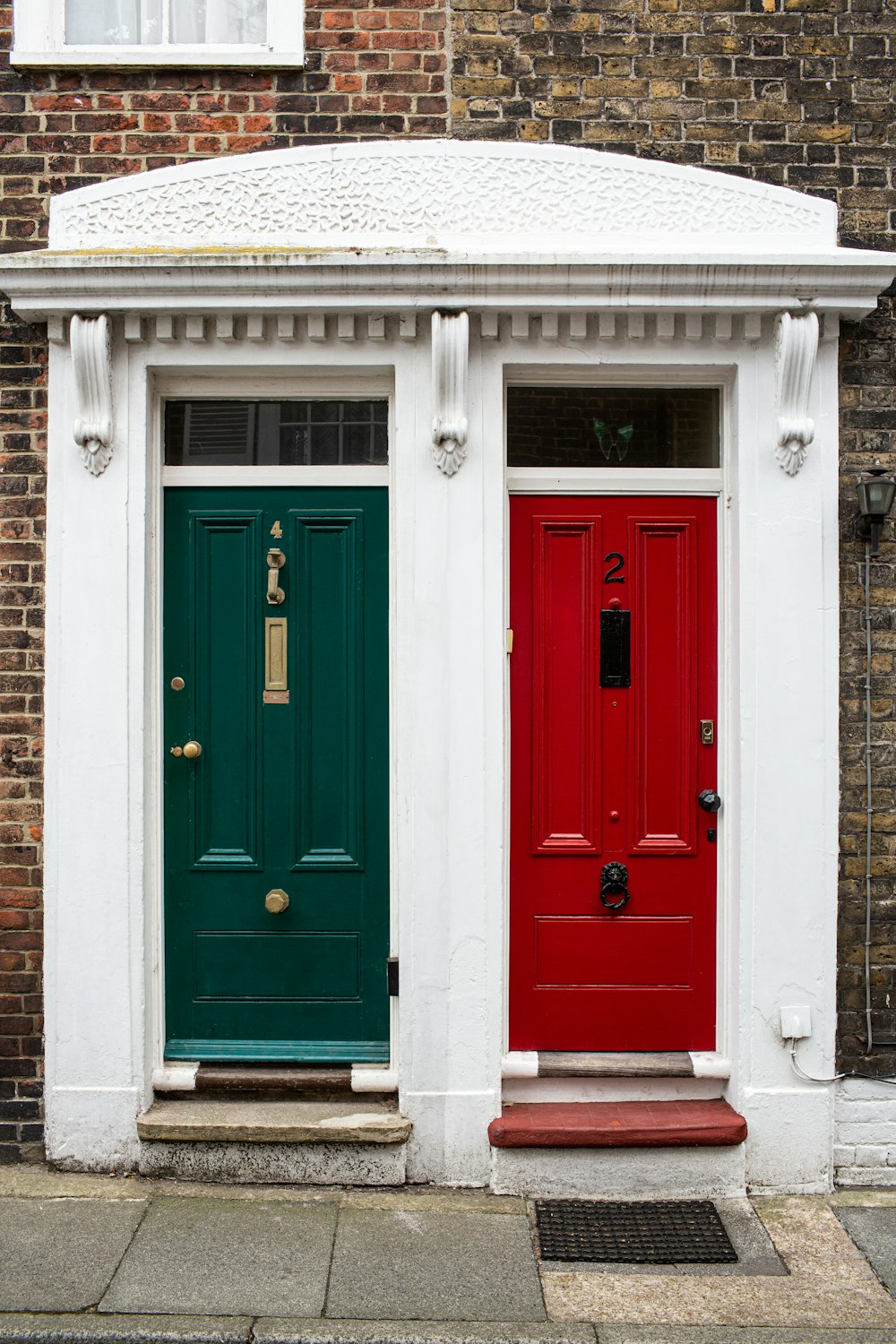 two green and red doors