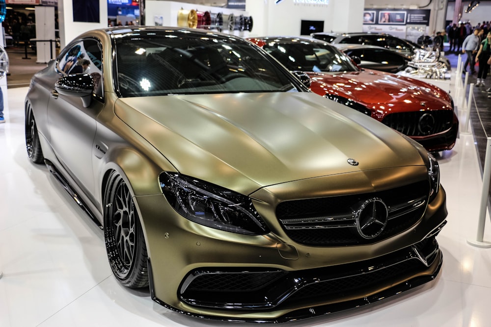 gold Mercedes-Benz coupe