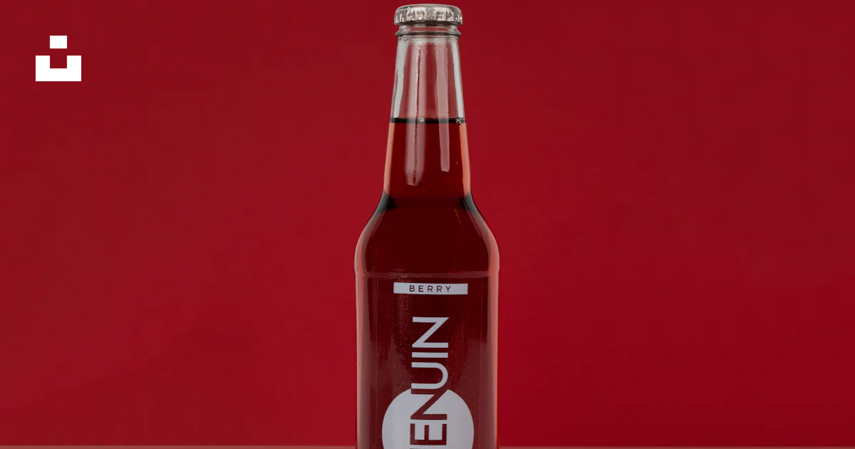 Jenuin Jenuin beverage bottle photo – Free Red Image on Unsplash