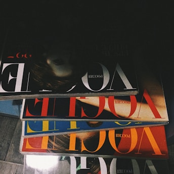 five assorted Vogue magazines