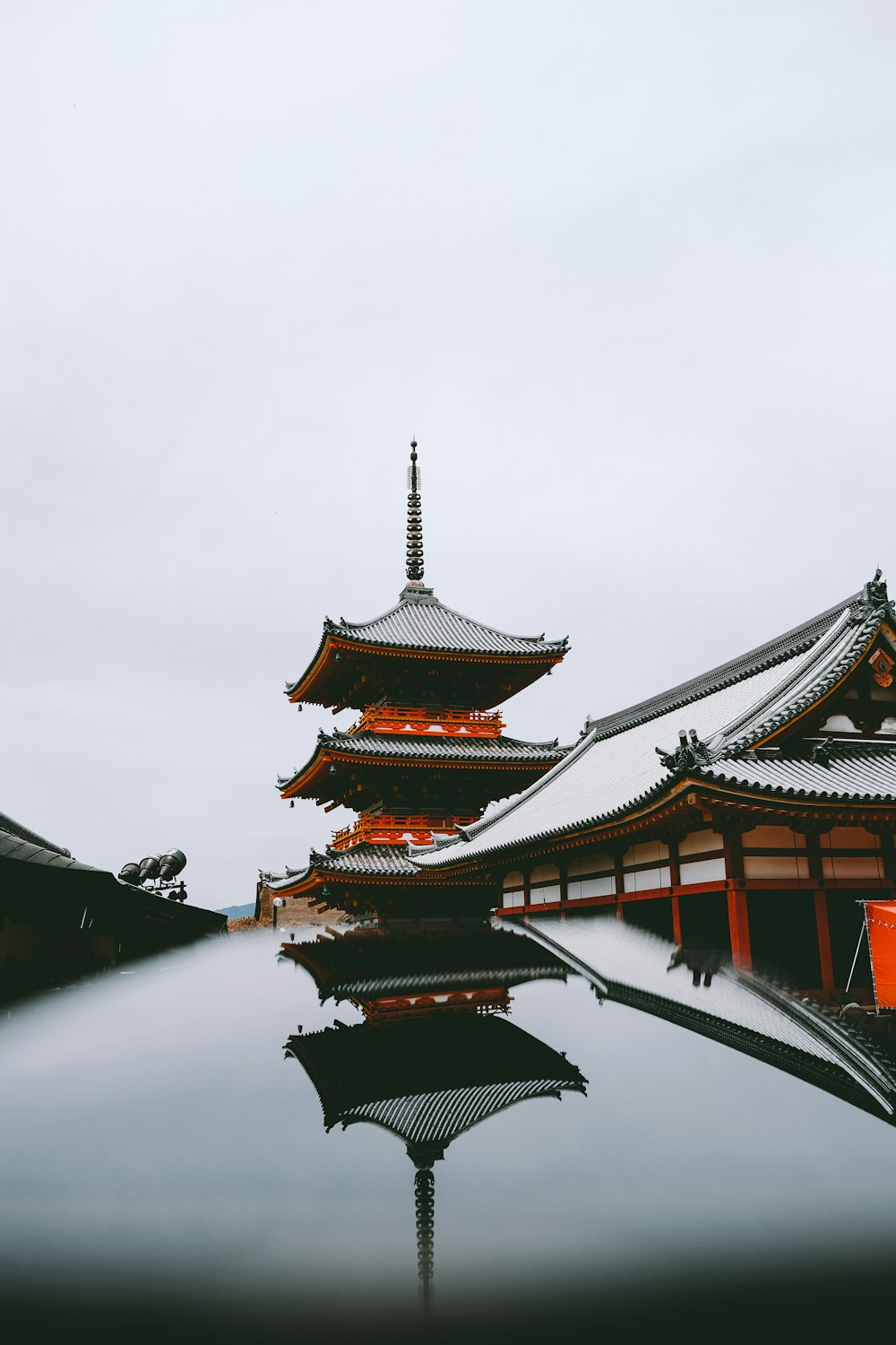 black and red temple under white sky at daytime