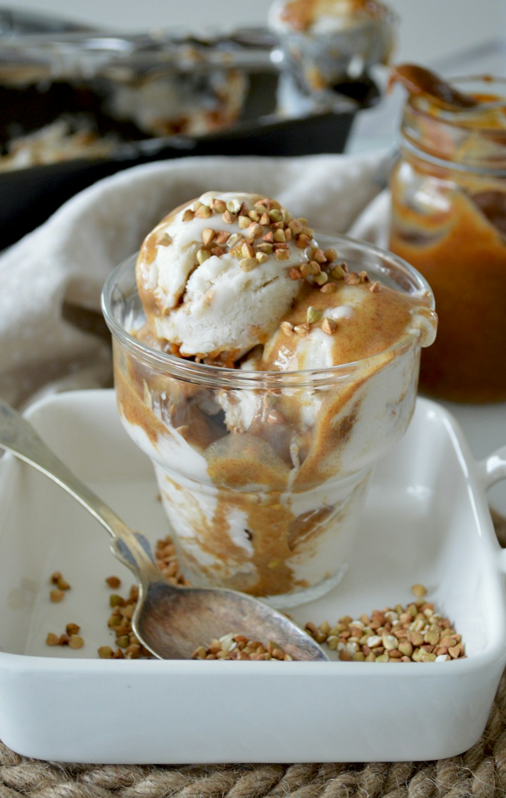 white and brown ice cream in cup close-up photography