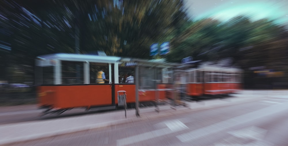 red, white, and black cable train during daytime