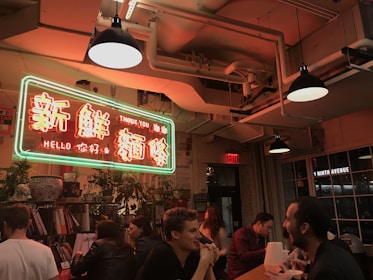 Students sharing stories in a cozy circle, blending English and Chinese expressions naturally.