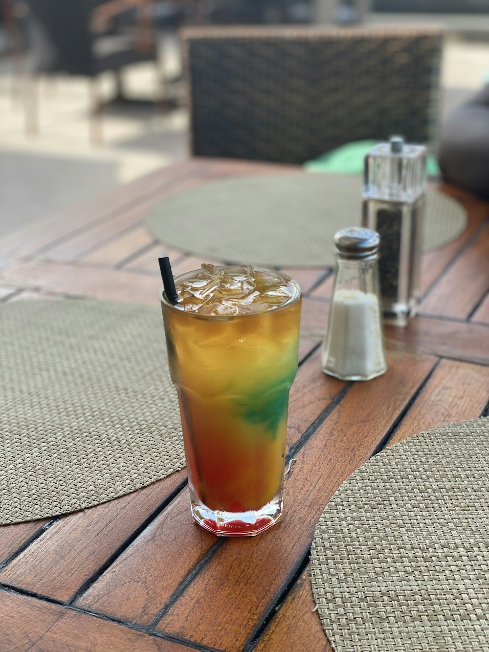 clear drinking glass on brown wooden table