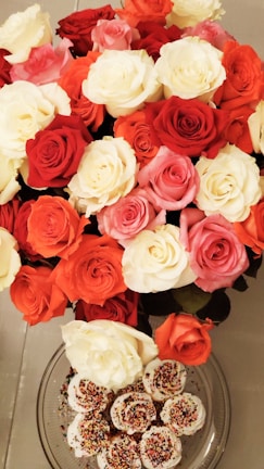 A beautifully arranged bouquet of colorful floral cupcakes.