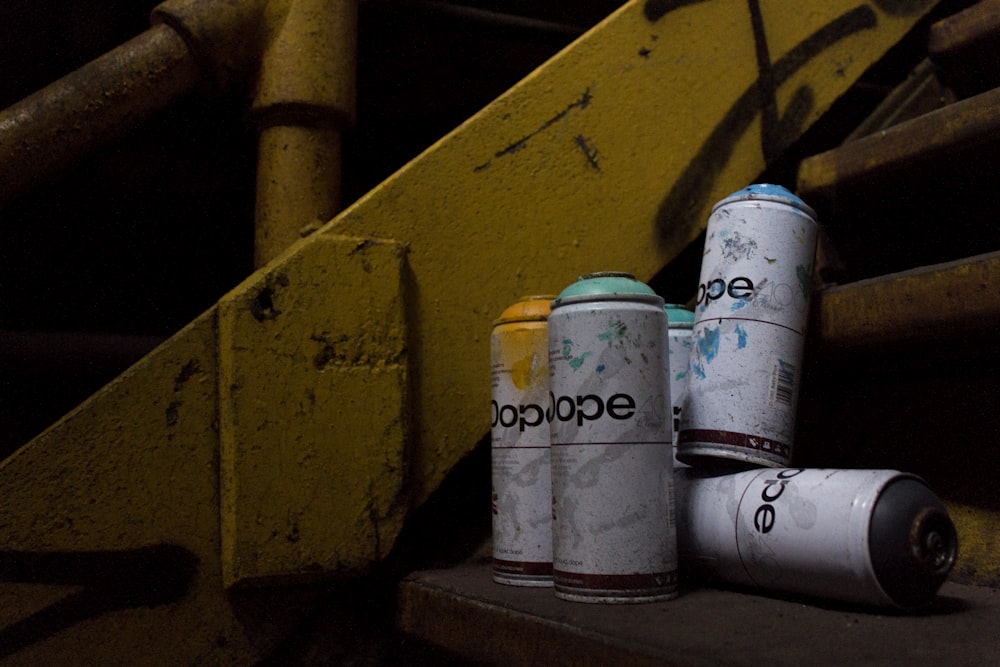 five spray cans