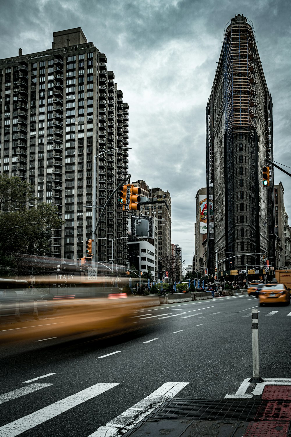 black concrete road near high buildings at daytime