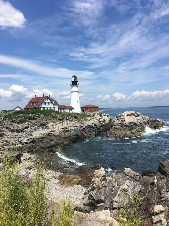 lighthouse near sea in Portland Head Lighthouse United States