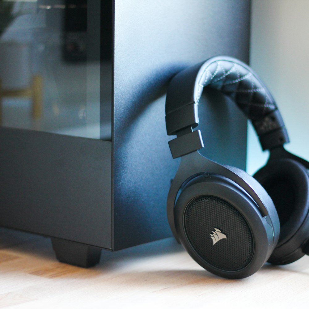 black headphones beside cabinet