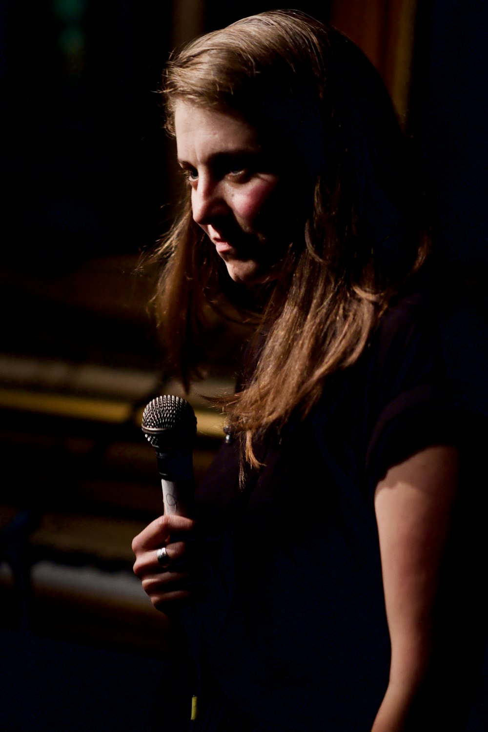 woman holding microphone